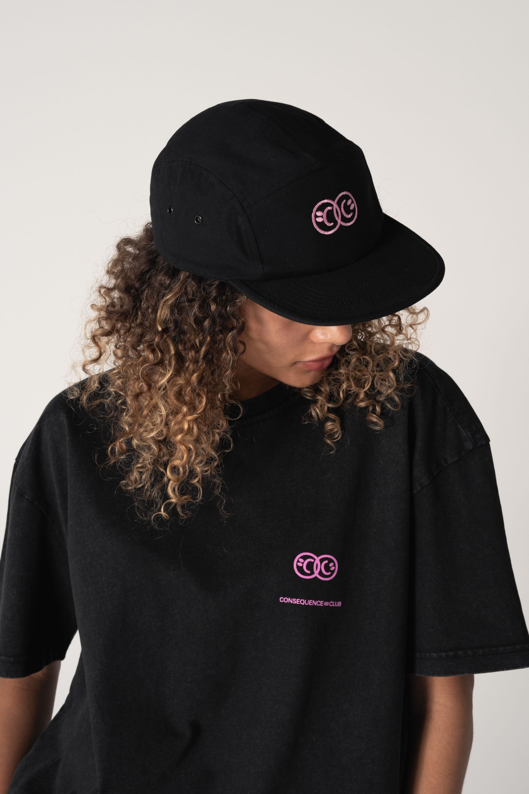 woman wearing cap and T-shirt