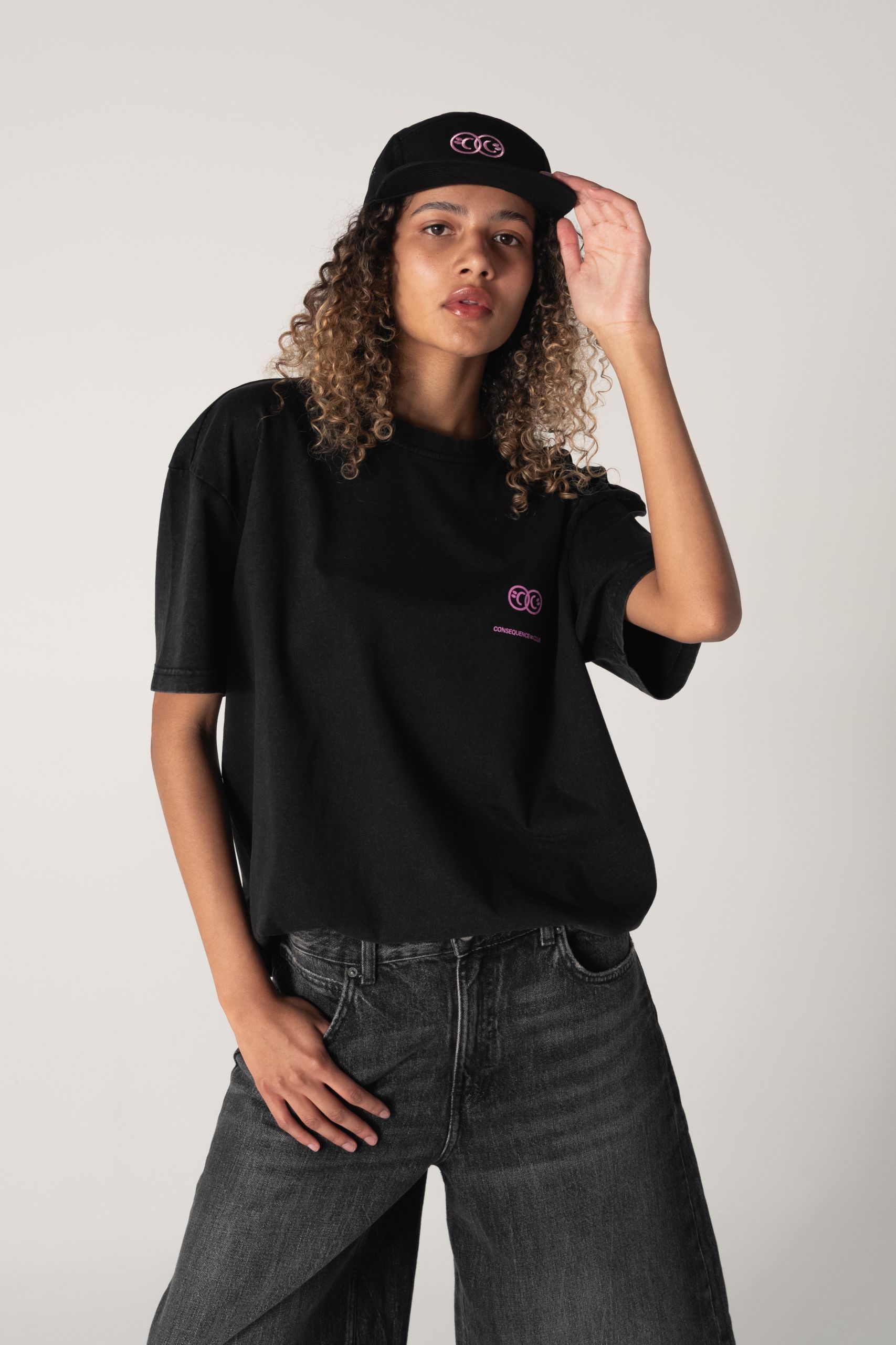 woman wearing cap and T-shirt